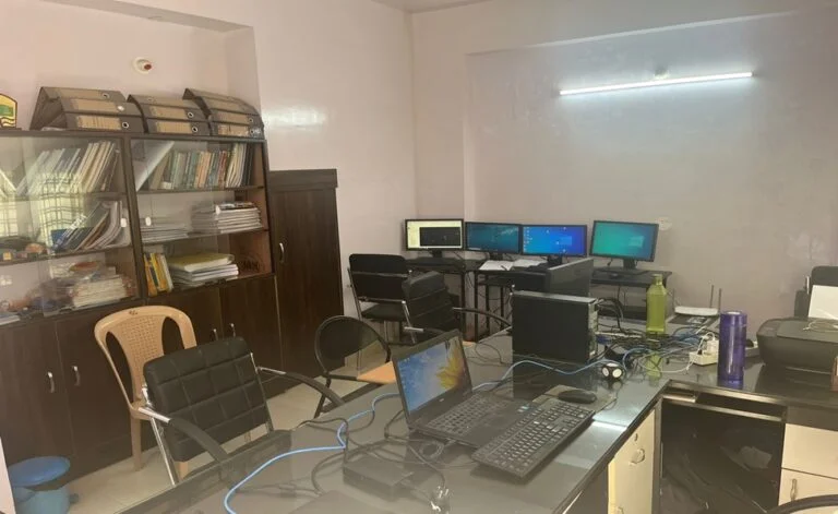 INDUSTRIAL AUTOMATION PLC SCADA training lab computers on a table.