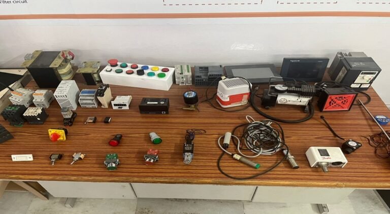 Industrial automation lab equipment and tool on a table.