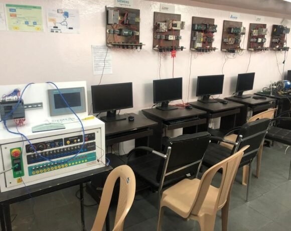 Close up shot of the tables and chairs with computers in the plc scada training classroom
